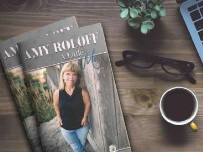 The cover of the book has Amy Roloff's picture on it with her name written in bold letters.